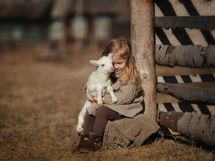 Girl holding a lamb