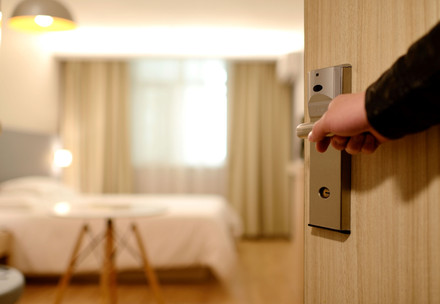 Door is opening to a hotel room