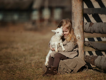 Kid with a lamb