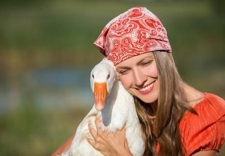 Woman holding a goose