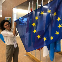 Vanessa Amoroso standing with EU flag 